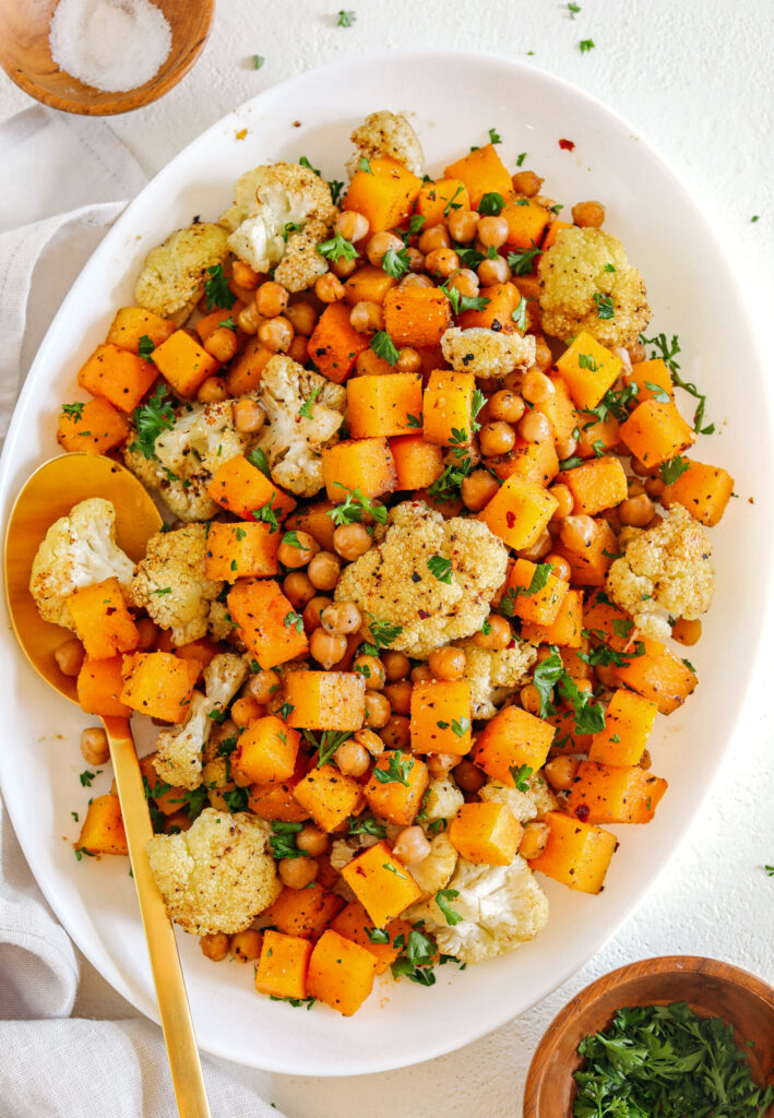 Roasted Squash, Cauliflower And Chickpeas That Are Perfectly Seasoned And Cooked All On One Sheet Pan For An Easy And Delicious Healthy Side Dish The Whole Family Will Love!