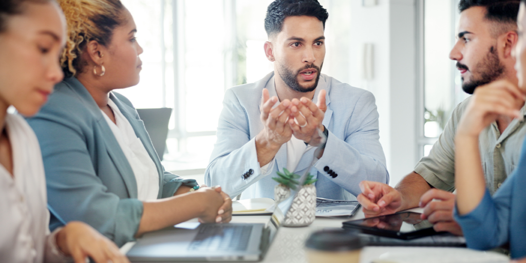 A Professional Who Received An Executive Management Position Leading A Meeting