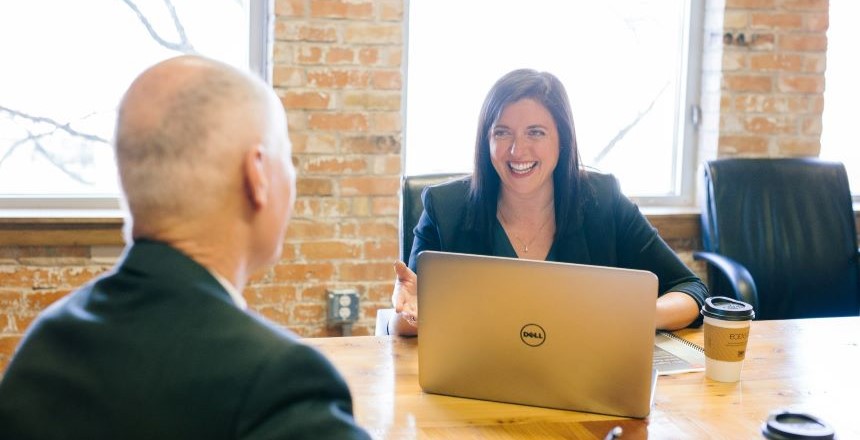 Smiling Leader Talking To Employee