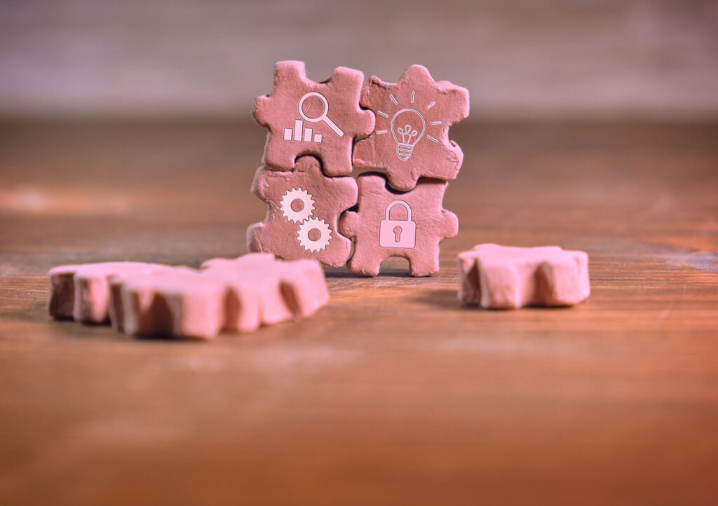 Brown Clay Puzzle Pieces Stacked To Form A Square.